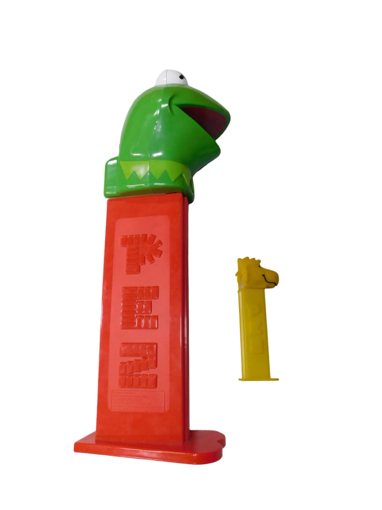 Two Pez Dispensers incl 1 Giant Kermit the Frog Pez Package Dispenser and: Two Pez Dispensers incl 1 Giant Kermit the Frog Pez Package Dispenser and 1 Peanuts Woodstock Pez Dispenser. Kermit plays The Muppet Show theme song when opened. Kermit height: 12"