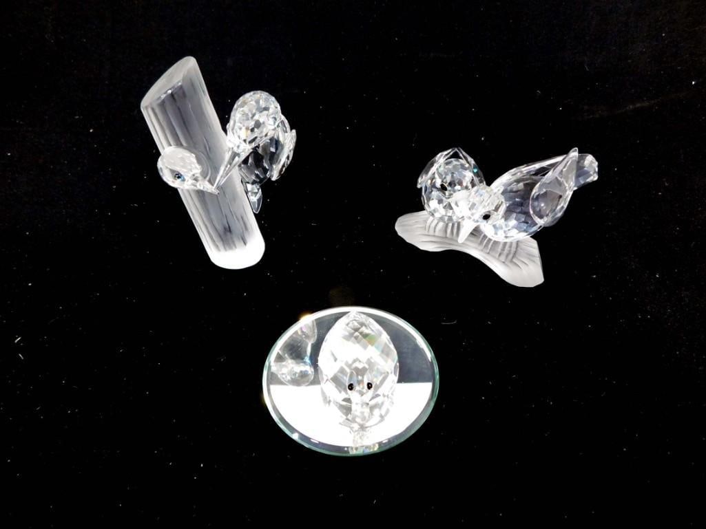 Swarovski Crystal Duck, Swarovski Crystal Birds on a Branch, and Crystal Woodpecke: Swarovski Crystal Duck, Swarovski Crystal Birds on a Branch, and Swarocski Crystal Woodpeckers on a Tree. The duck has the Swarovski mark, the birds on a branch has the Swarovski crystal mark on the e