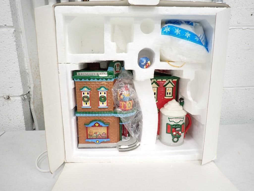 Dept 56 Saturday Morning Downtown Christmas Village Buildings: Department 56 Saturday Morning Downtown Christmas Village Buildings. Includes only what you see in the pictures. No lights and only 1 figure is included. Includes 2 buildings.
