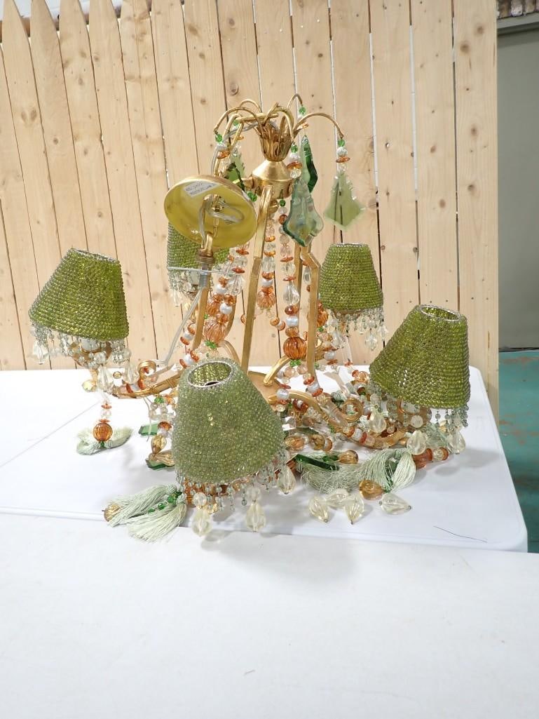 Vintage Chandelier with all sorts of beads and glass, green shades, etc.: Vintage Chandelier with all sorts of beads and glass, green shades, etc. Looks like someone may have had some fun throwing it together. Unclear if this is how it started out.