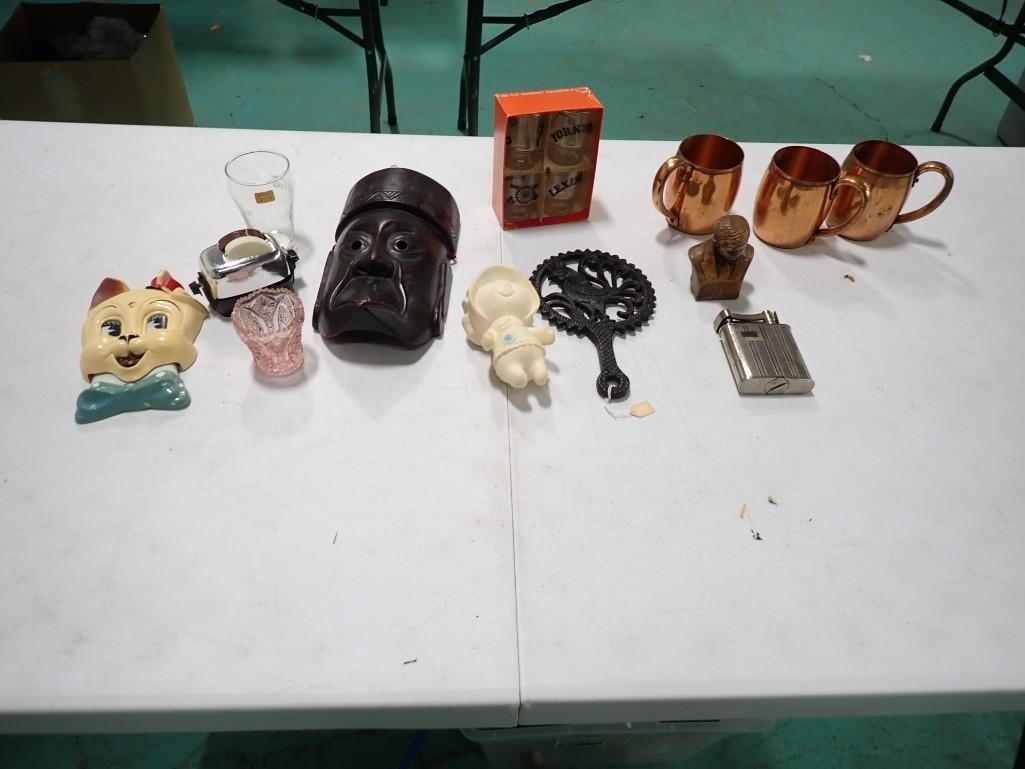 3 Copper Miller Lite Mugs, Anchor Hocking Shot Glasses, Cast Iron Trivet, Wooden Tribal Style Mask,: Lot of assorted collectibles including 3 Copper Miller Lite Mugs, Anchor Hocking Shot Glasses, Cast Iron Trivet, Wooden Tribal Style Mask, Large Lighter, Will Roger Bust, Toaster Salt and Pepper Shake
