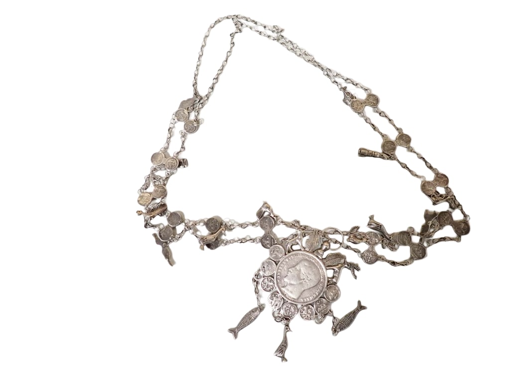 A Guatemalan Silver Coin Chachal Necklace: A Guatemalan Silver Coin Chachal Necklace