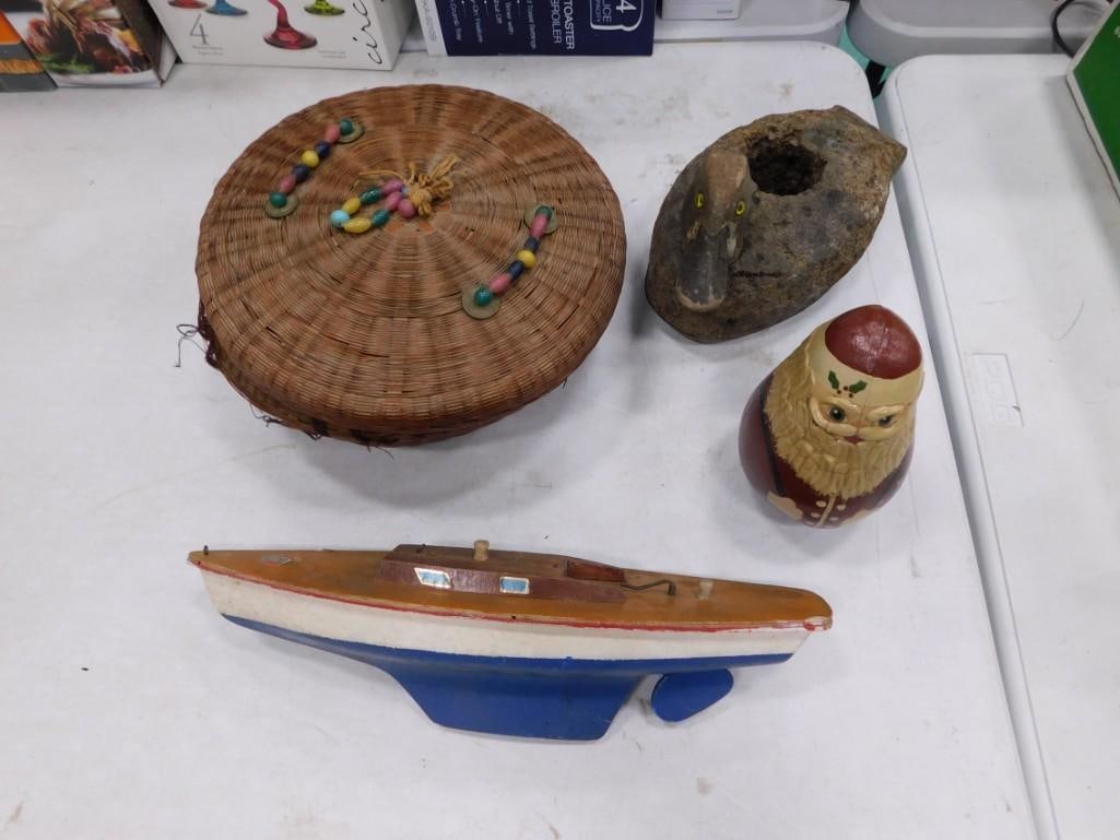Misc. Lot including Duck Decoy, Woven basket, Sewn hand painted leather Santa Claus and a toy boat: Misc. Lot including Duck Decoy, Woven basket with cover, Sewn hand painted leather Santa Claus and a toy boat