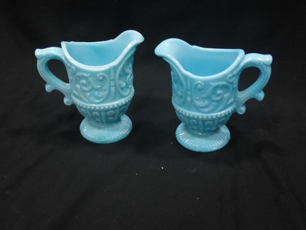 2 Vintage Portieux Vallerysthal Creamers Blue Milk Glass: 2 Vintage Portieux Vallerysthal Creamers Blue Milk Glass Condition: 1 has many hairline cracks, most of which do not go all the way through. The other has no chips or cracks