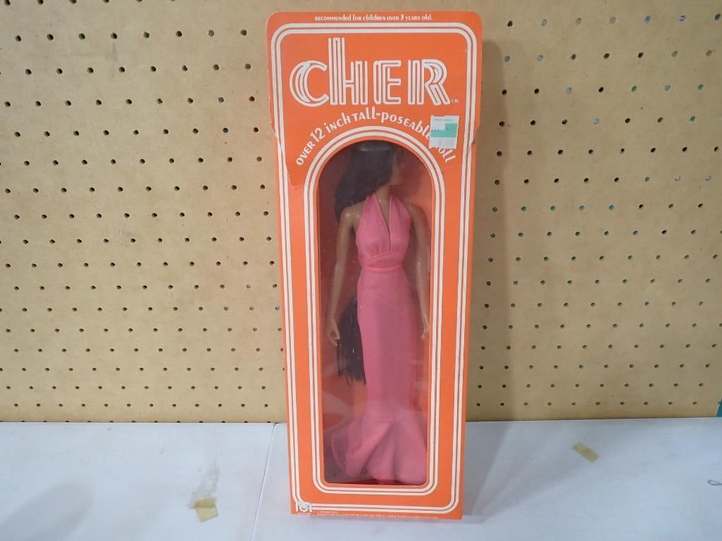 Vtg 1976 Cher Poseable Doll in Original Box by Mego Approx 12" Tall: Vintage 1976 Cher Poseable Doll in Original Box by Mego. Approximately 12" tall. Condition: She is new old stock and has not been removed from the box. The box has a small tear near the top. Pleas
