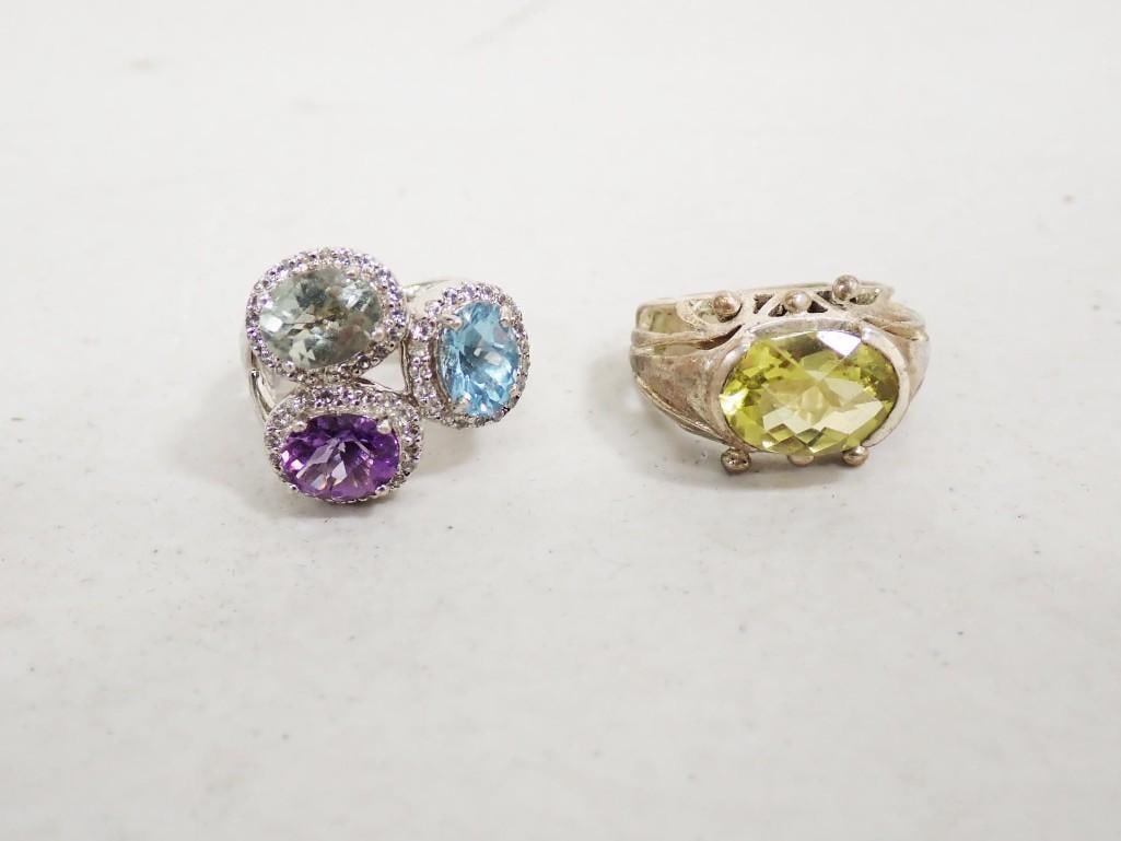 2 Rings incl 1 Sterling Silver Marked .925: 2 Rings incl 1 Sterling Silver Marked .925 . The one with the yellow gemstone is marked .925
