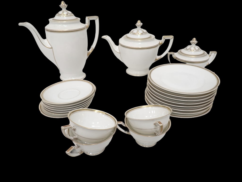 German Hutschenreuther Gilt Porcelain Tea and Coffee Service: German Hutschenreuther Gilt Porcelain Tea and Coffee Service, including a coffee pot, a teapot, a covered sugar bowl, 8 plates (diameter: 7 5/8") and 5 teacups with 6 saucers.