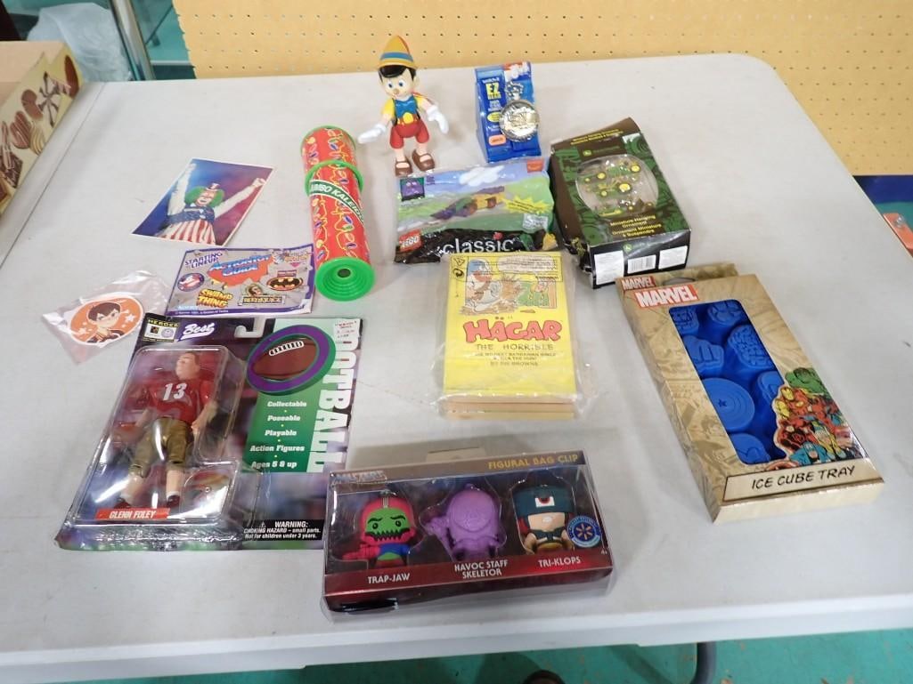 Misc. Toy Lot including Marvel Ice Cube Tray, Masters of the Universe Bag Clips, Pinocchio, Lego, (1 of 3)