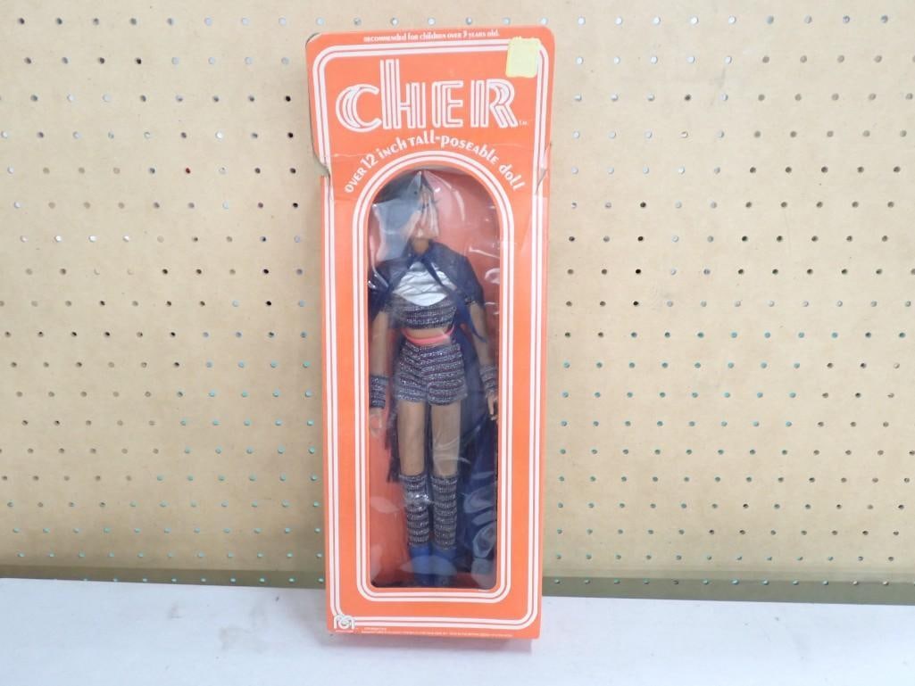 Vintage 1976 Mego 12" Poseable Cher Doll with Box.: Vintage 1976 Mego 12" Poseable Cher Doll with Box. Box has significant damage and the doll is dirty / dusty. Unclear if this was taken out or not, but the top of the box is open and dust /