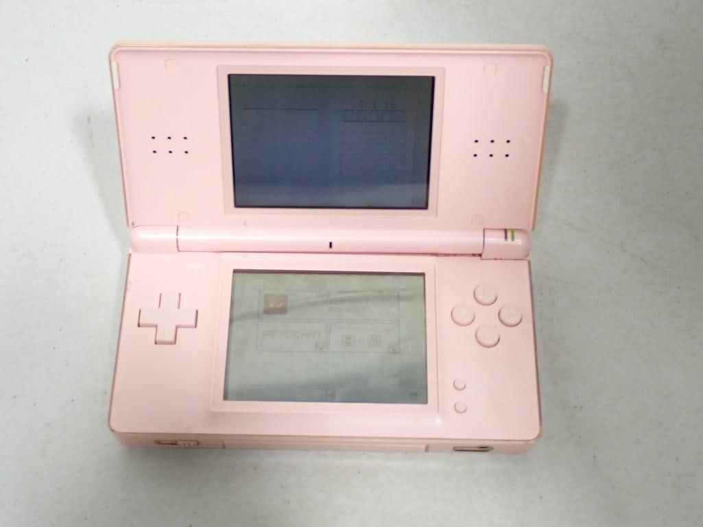 Nintendo DS - Pink Color - system turns on and both screens light up: Nintendo DS - Pink Color - system turns on and both screens light up. Comes with everything as shown.