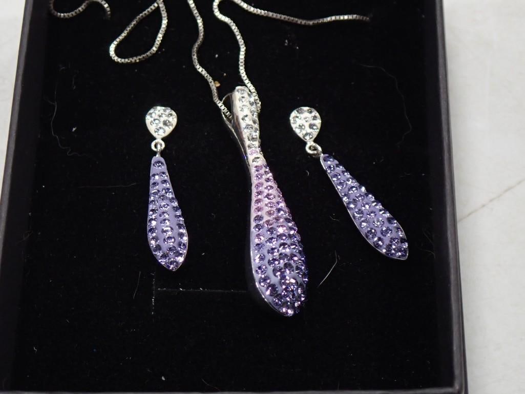 Sterling Silver Necklace and Earrings with Purple Rhinestones .925: Sterling Silver Necklace and Earrings with Purple Rhinestones .925 Live Auctioneers is now offering Live Shipping through them. This is an optional payment/shipping system. If you would like to use th