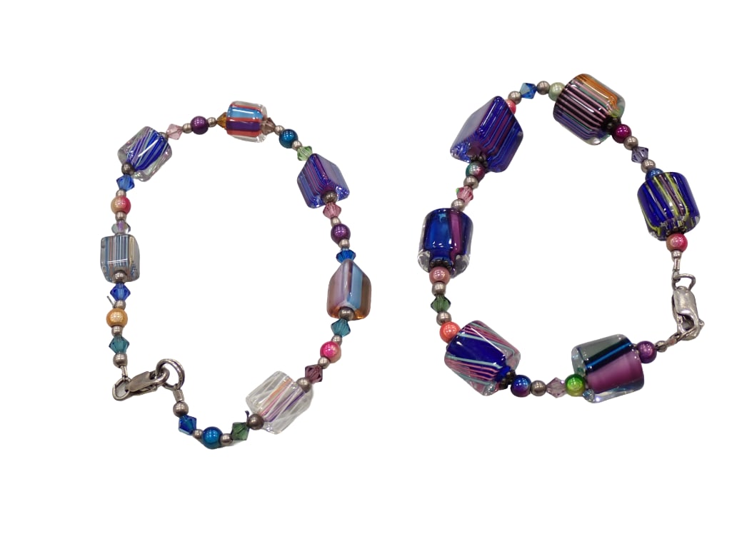 2 Art Glass Beaded Bracelets with Sterling Silver Clasps: 2 Art Glass Beaded Bracelets with Sterling Silver Clasps Live Auctioneers is now offering Live Shipping through them. This is an optional payment/shipping system. If you would like to use the UPS Sto