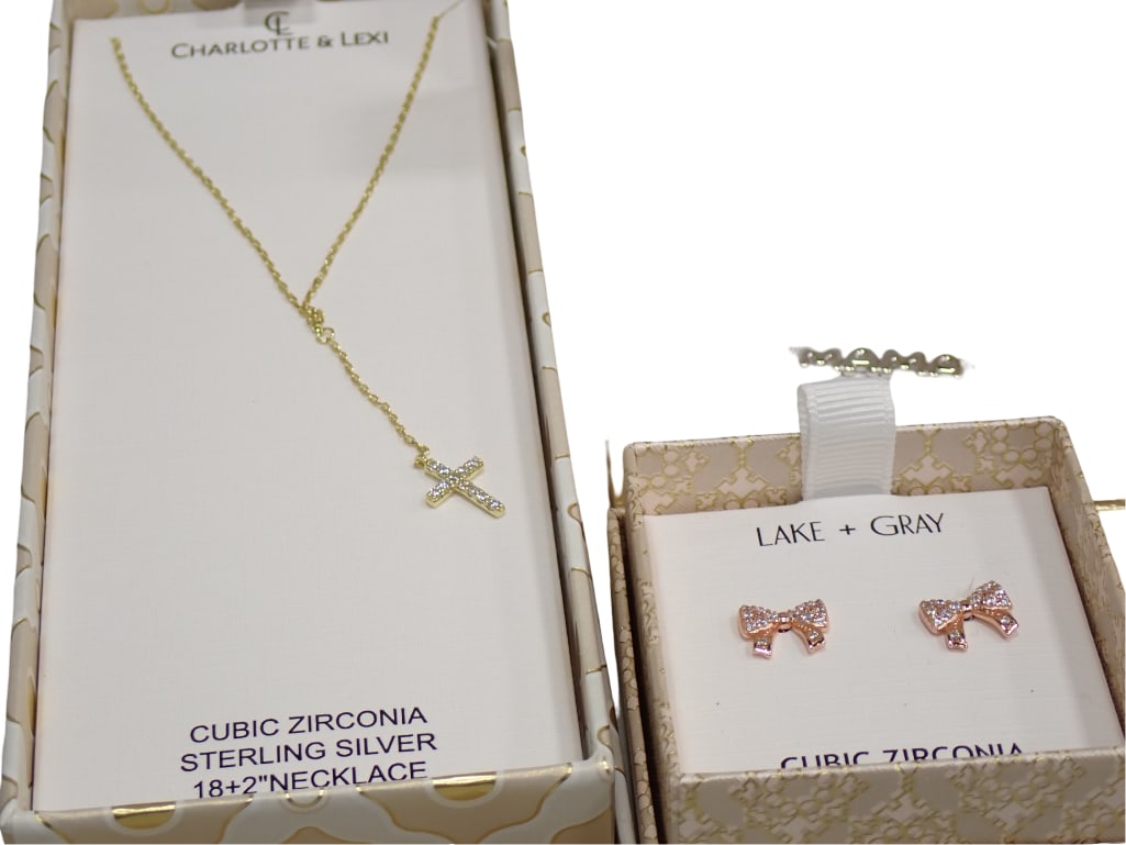 Cubic Zirconia and Sterling Silver Cross Necklace and Bow Earrings: Cubic Zirconia and Sterling Silver Cross Necklace and Bow Earrings Live Auctioneers is now offering Live Shipping through them. This is an optional payment/shipping system. If you would like to use th
