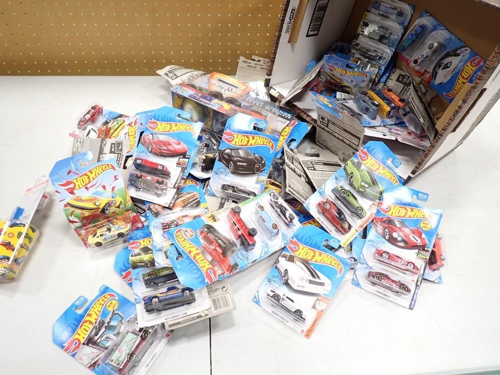 Large Lot of approx 67 New in Package Mattel Hot Wheels Cars: Large Lot of approximately 67 New in Package Mattel Hot Wheels Cars including Monster Jam Color Change Live Auctioneers is now offering Live Shipping through them. This is an optional payment/shippin