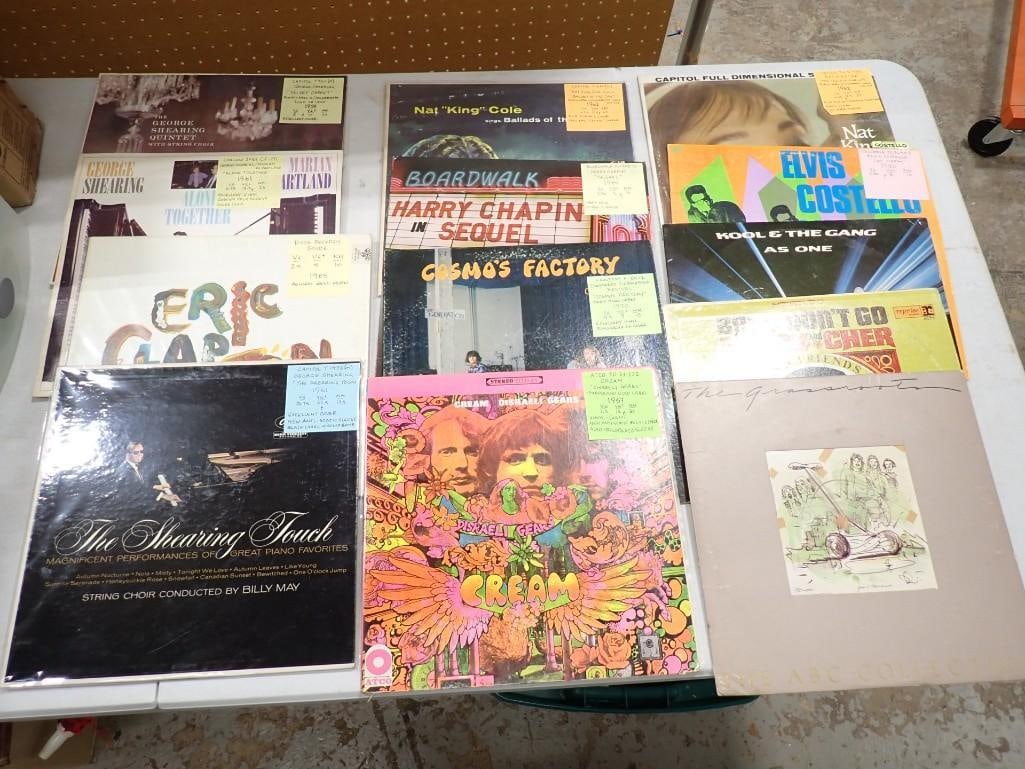 Vinyl Record Albums including George Shearing, Clapton, Harry Chapin, Nat King Col, Elvis Costello: Vinyl Record Albums including George Shearing, Clapton, Harry Chapin, Nat King Col, Elvis Costello, Cosmo's Factory, Grassroots, Kool & The Gang, Sonny & Cher, etc.Many have post it notes 