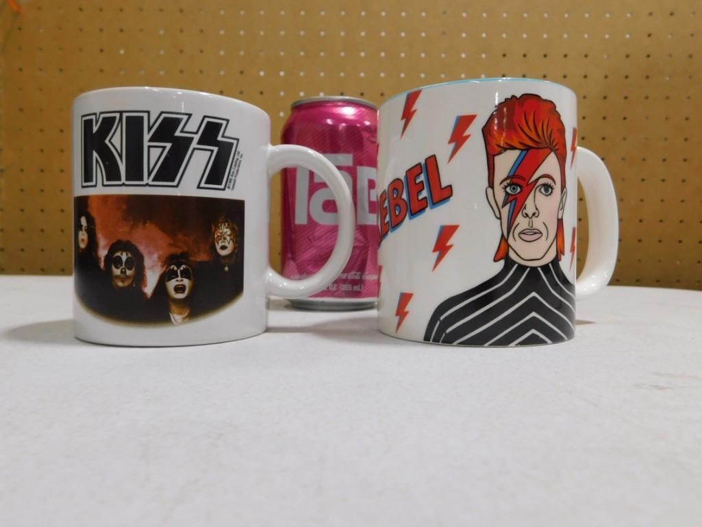 Pair of Coffee Mugs including David Bowie Rebel Rebel and The Rock Band Kiss: Pair of Coffee Mugs including David Bowie Rebel Rebel and The Rock Band Kiss.? Coffee tastes better out of these mugs and music sounds better after drinking from these mugs! 5x4x4" Live Auctionee