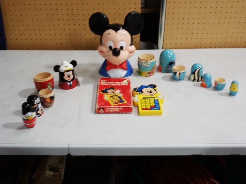 Disney Lot incl Mickey Mouse Coin Bank, Mickey Mouse Kiddy Calculator with Original Box,: Disney Lot incl Mickey Mouse Coin Bank made of plastic or vinyl, Mickey Mouse Kiddy Calculator with Original Box, Disney Nesting Dolls, Finding Nemo nesting dolls. Live Auctioneers is now offering Li