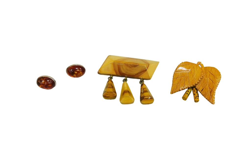 Baltic jewelry; pair of sterling silver and oval cabochon amber stud earrings and two carved and pol: Baltic jewelry; pair of sterling silver and oval cabochon amber stud earrings and two carved and polished wood pins, both with drops? Live Auctioneers is now offering Live Shipping through them. This 