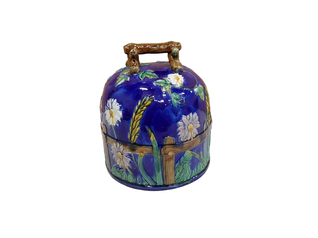 Majolica cheese / cake dome in the style of George Jones, cobalt ground exterior with stick form han: Majolica cheese / cake dome in the style of George Jones, cobalt ground exterior with stick form handle and turquoise interior. Exterior decorated with daisies and wheat stalks against a continuous pi