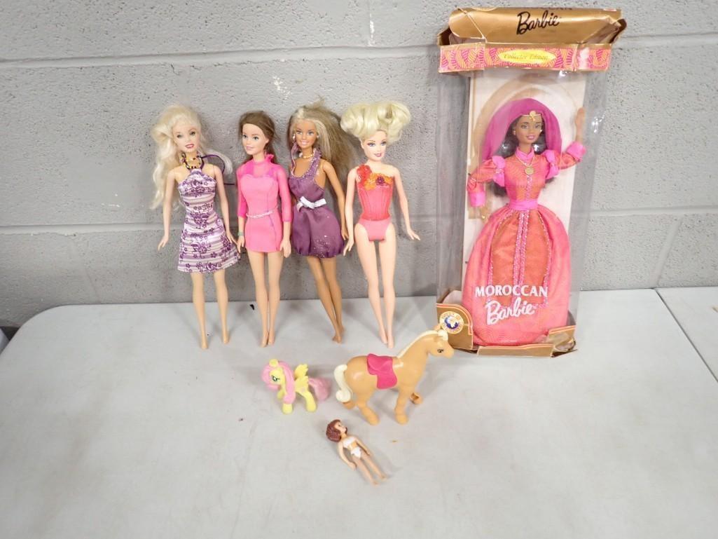 Moroccan Barbie in Original Damaged Box and Other Loose Barbies and Fashion Dolls: Moroccan Barbie in Original Damaged Box and Other Loose Barbies and Fashion Dolls plus 2 Toy Horses and a Polly Pocket Doll All pictures are considered part of the description and should be examined