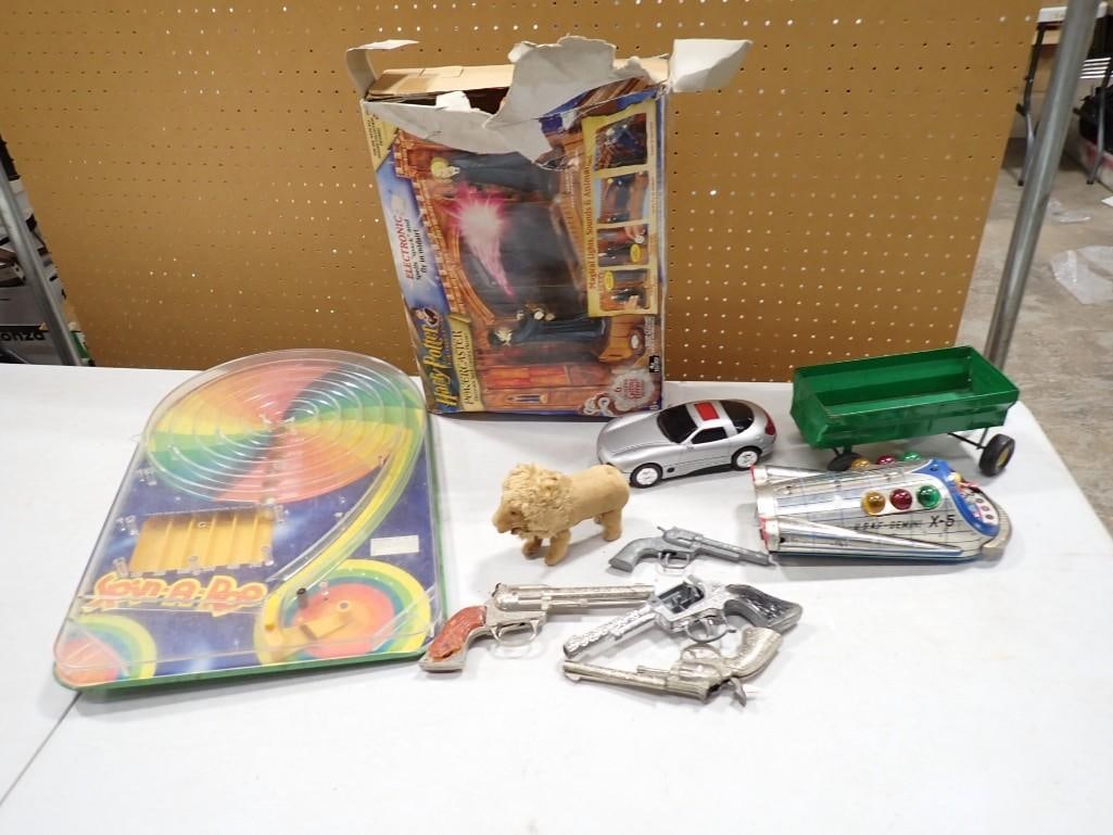 Vintage Toy Lot including Wolverine Spin-A-Roo Marble Game, Cap Guns, Japanese Lion, Pressed Steel: Vintage Toy Lot including Wolverine Spin-A-Roo Marble Game, Cap Guns, Japanese Lion, Pressed Steel Wagon, Car, U.S.A.F. Gemini X-5 Toy untested, etc. Spring on the marble game needs to be reattached.