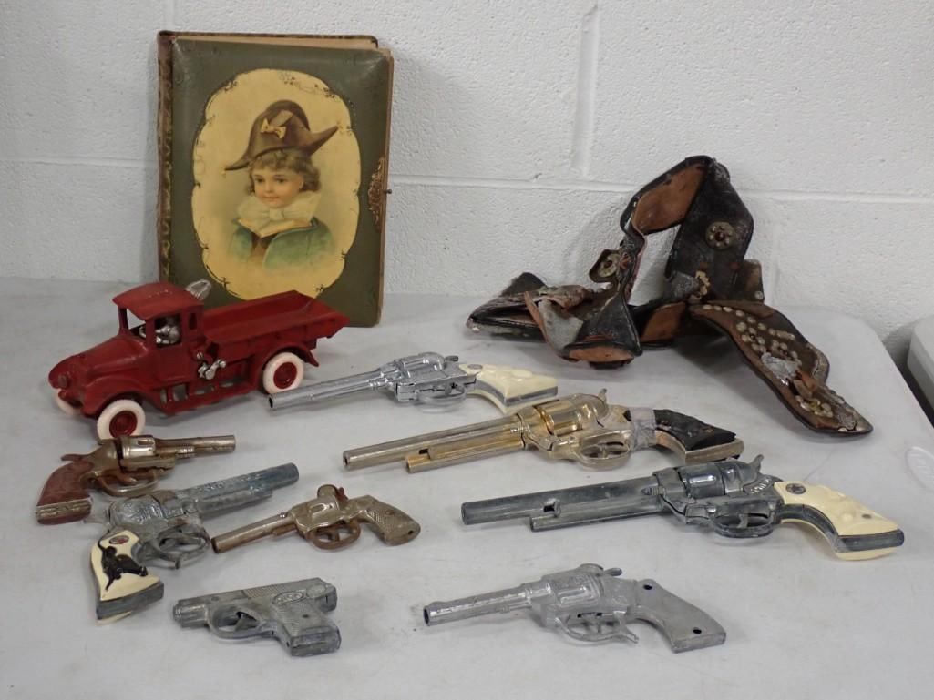 Lot of Vintage Cap Guns, Toy Guns, Holsters, etc. Cowboy, Dick, Buck, Kido, Texan, etc.: Lot of Vintage Cap Guns, Toy Guns, Holsters, etc. Cowboy, Dick, Buck, Kido, Texan, etc. All pictures are considered part of the description and should be examined carefully by bidders. Live Auctioneer
