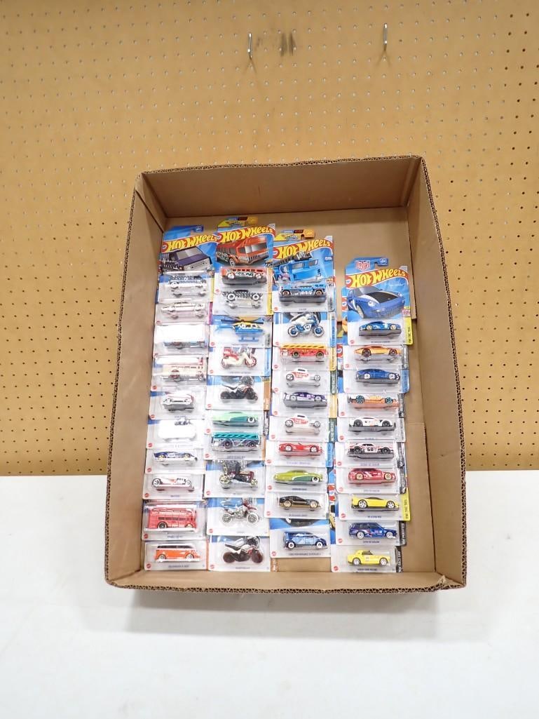 Lot of roughly 40 new in package Hot Wheels Cars / Motorcycles /etc.: Lot of roughly 40 new in package Hot Wheels Cars / Motorcycles /etc. 6x4x1" All pictures are considered part of the description and should be examined carefully by bidders. Live Auctioneers is now
