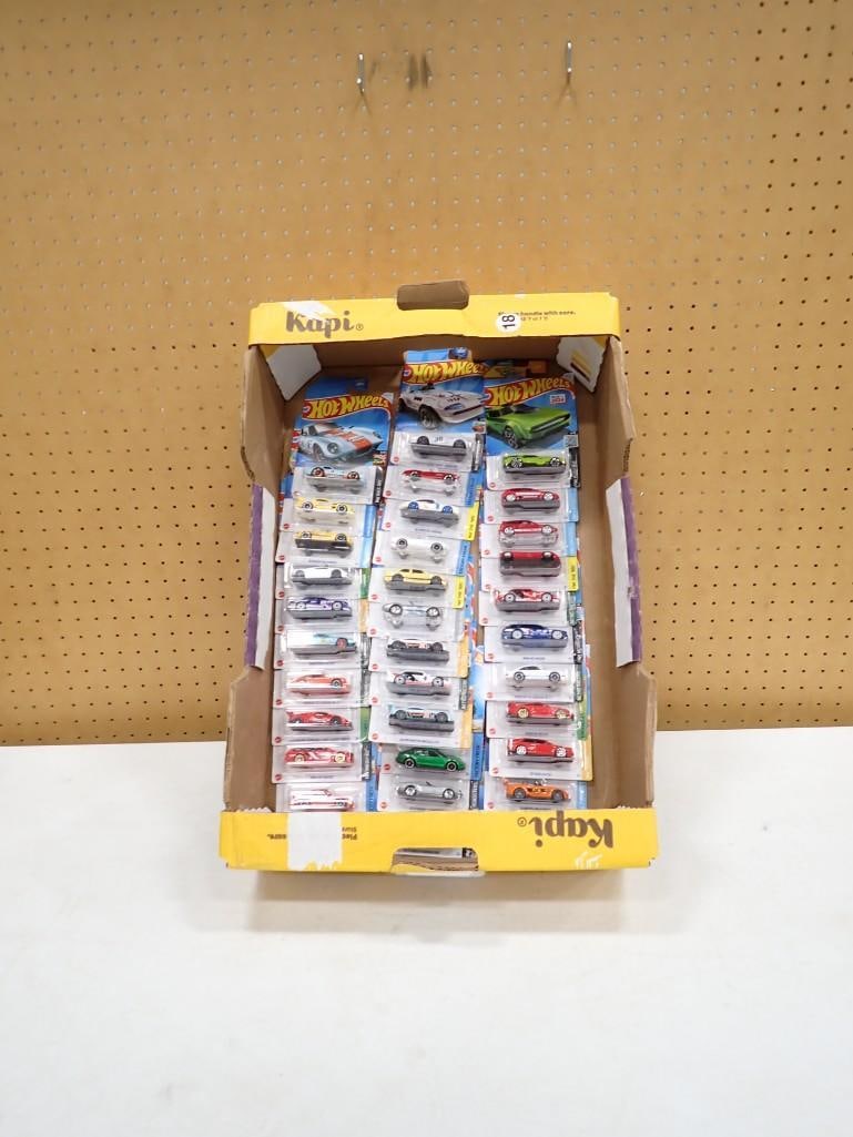 Lot of roughly 34 new in package Hot Wheels Cars: Lot of roughly 33 new in package Hot Wheels Cars 6x4x1" All pictures are considered part of the description and should be examined carefully by bidders. Live Auctioneers is now offering Live Shipp