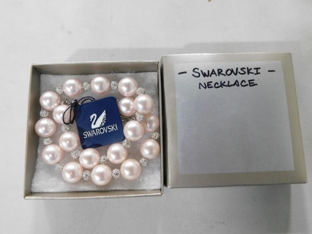 Swarovski Crystal and Pink Pearl Necklace with Tag: Swarovski Crystal and Pink Pearl Necklace with Tag All pictures are considered part of the description and should be examined carefully by bidders. Live Auctioneers is now offering Live Shipping throu