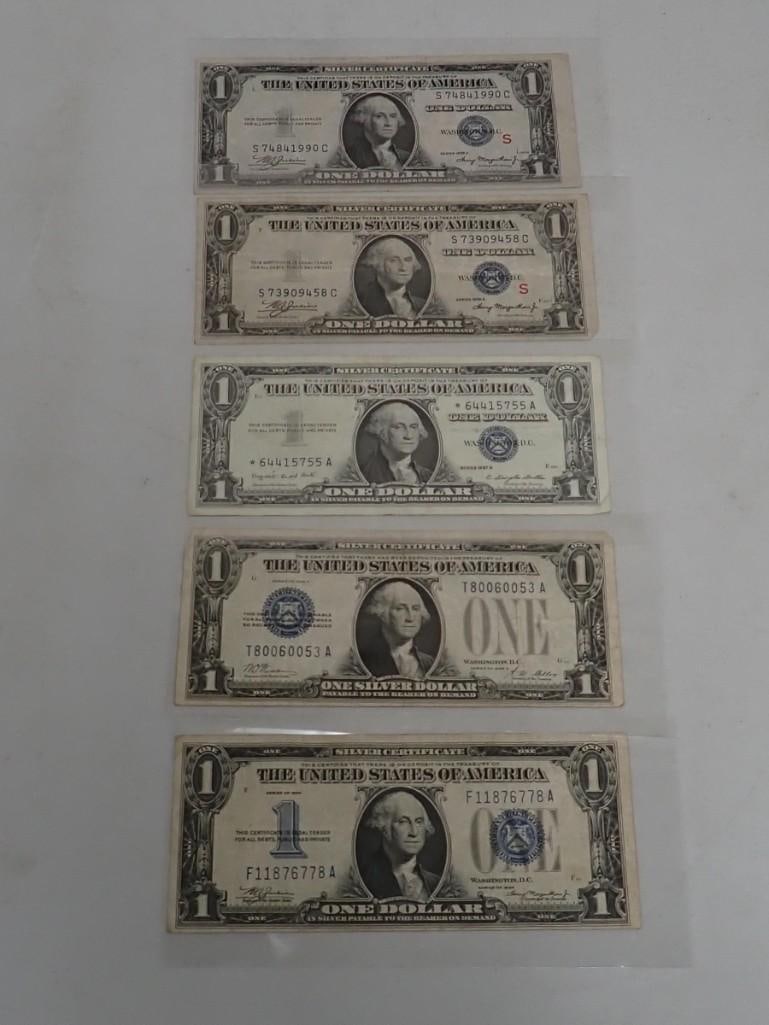 Lot of 5 Blue Seal S$1 Silver Certificates including a star note and two with a Red "S" (1 of 2)