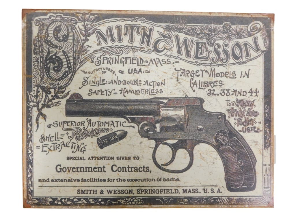 Smith & Wesson Metal Sign Modern Retro: Smith & Wesson Metal Sign Modern Retro .? Measures approx 16"x13" All pictures are considered part of the description and should be examined carefully by bidders. Live Auctioneers is now