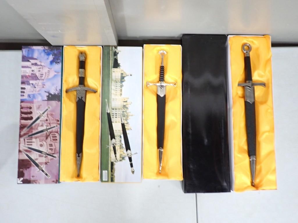 3 Daggers or Knives with Sheaths New in Boxes: 3 Daggers or Knives with Sheaths New in Boxes All pictures are considered part of the description and should be examined carefully by bidders. Live Auctioneers is now offering Live Shipping through