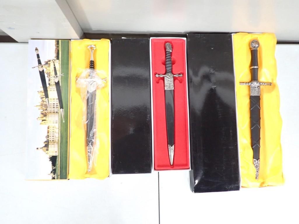3 Daggers or Knives with Sheaths New in Boxes: Lot of 3 Daggers or Knives with Sheaths New in Boxes All pictures are considered part of the description and should be examined carefully by bidders. Live Auctioneers is now offering Live Shipping t
