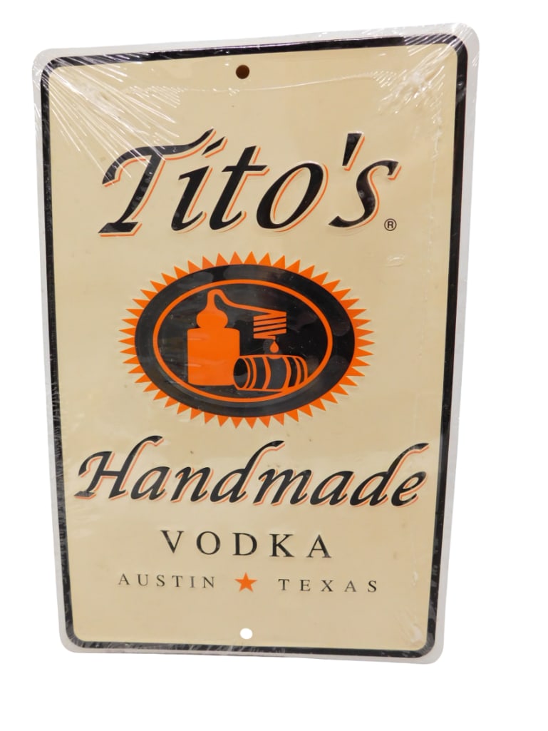 Titos Handmade Vodka Metal Bar Sign 12"x8": Titos Handmade Vodka Metal Bar Sign 12"x8" All pictures are considered part of the description and should be examined carefully by bidders. Live Auctioneers is now offering Live Shipping throu