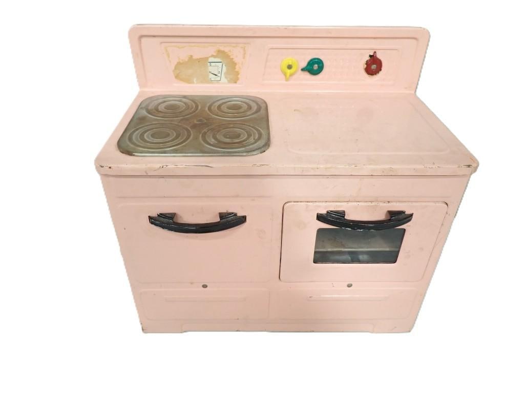 Vintage Little Lady Children's Metal Tin Style Pink Stove: Vintage Little Lady Children's Metal Tin Style Pink Stove 13x12x7" All pictures are considered part of the description and should be examined carefully by bidders. Live Auctioneers is no