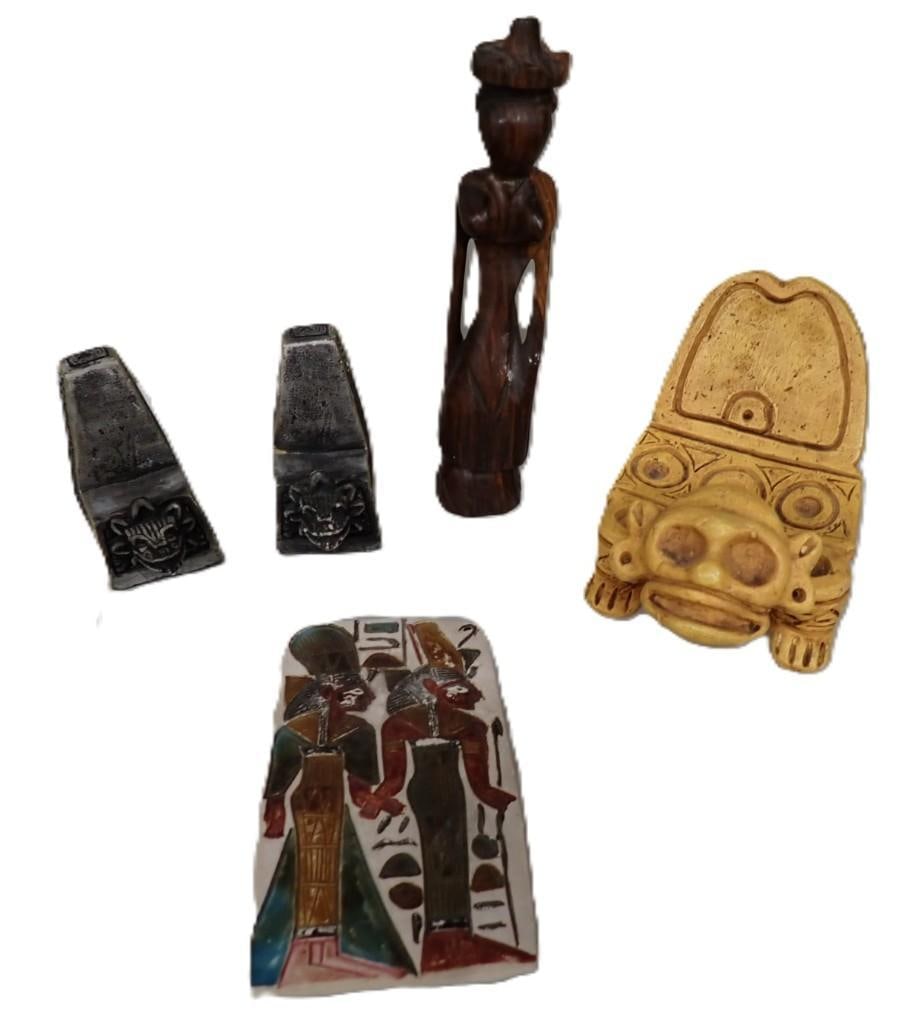 Lot of Egyptian and tribal Decor including Bookends, Carved Wood, etc.: Lot of Egyptian and tribal Decor including Bookends, Carved Wood, etc. All pictures are considered part of the description and should be examined carefully by bidders. Live Auctioneers is now offering