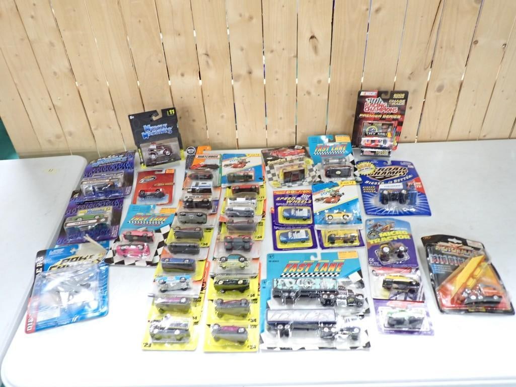 Lot of Roughly 40 New in Package Matchbox and Other Cars - Muscle Machines, Racing Champions: Lot of Roughly 40 New in Package Matchbox and Other Cars - Muscle Machines, Racing Champions, Fast Lane, Road Champs, Micro Tractor, etc.