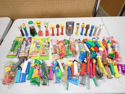 Collection of Pez Dispensers incl Some New in Package: Large lot of Pez dispensers incl some new in package. Largest package is 5"x2" . Includes Mickey Mouse, Fred Flintstone, etc All pictures are considered part of the description and shou