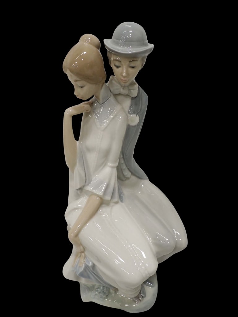 Nao by Lladro 0208 Shy Love Porcelain Figurine 17": Nao by Lladro 0208 Shy Love Porcelain Figurine 17" . No chips or repairs. All pictures are considered part of the description and should be examined carefully by bidders. Live Auctioneers is