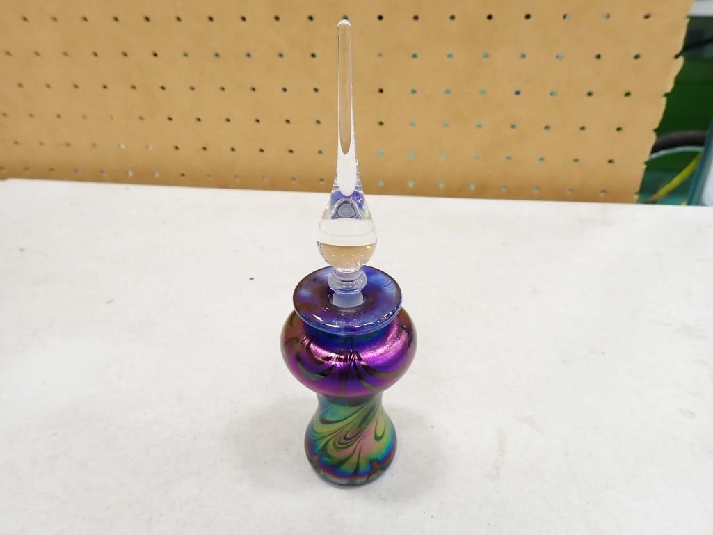 Hand Blown Iridescent Glass Signed Perfume Bottle with Stopper: Hand Blown Iridescent Glass Signed 7" Perfume Bottle with Stopper All pictures are considered part of the description and should be examined carefully by bidders. Live Auctioneers is now offering Live
