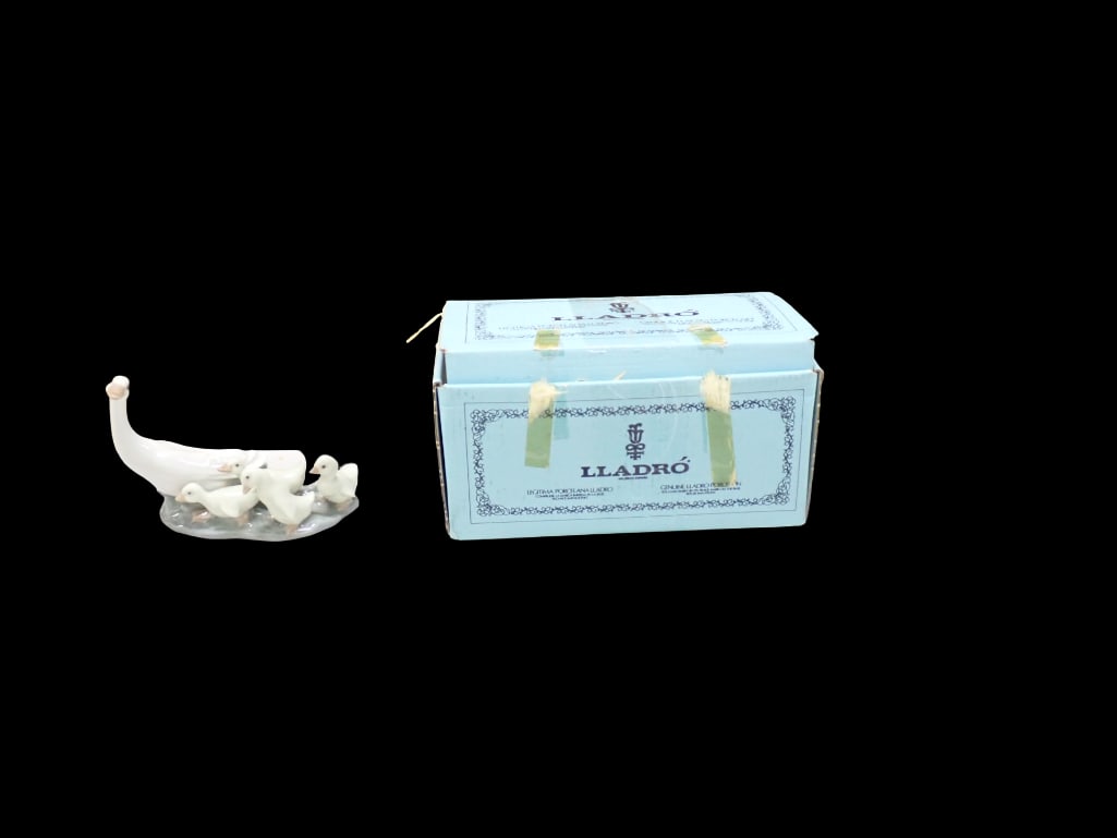 Lladro 1301 Little Ducks After Mother Porcelain Figurine in Original Box: Lladro 1301 Little Ducks After Mother Porcelain Figurine in Original Box All pictures are considered part of the description and should be examined carefully by bidders. Live Auctioneers is now offeri