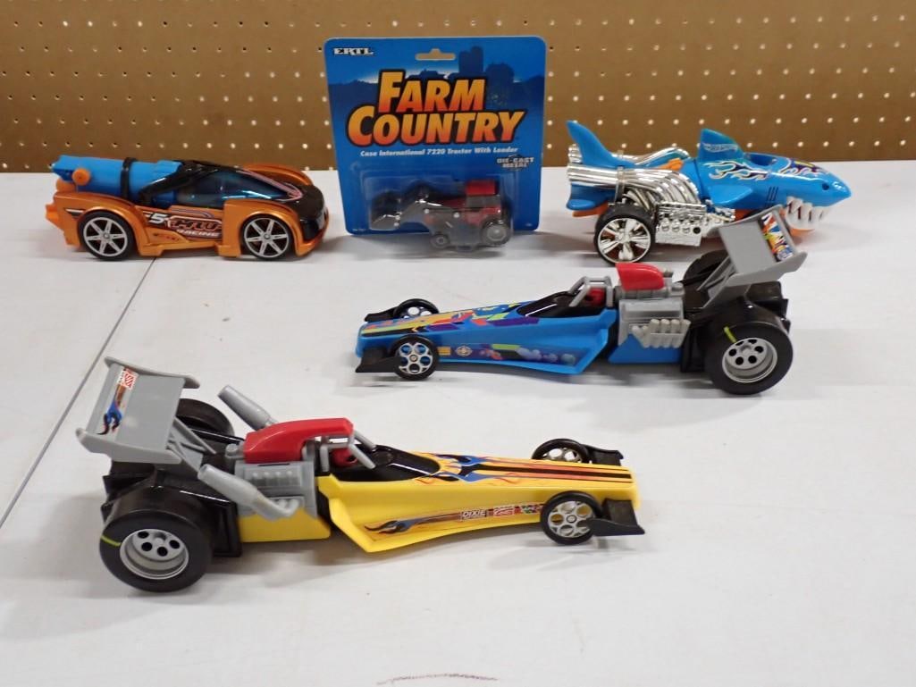 Toy Lot including Ertl Tractor New in Package, Shark Car, Dragsters, Hot Wheels, etc.: Toy Lot including Ertl Tractor New in Package, Shark Car, Dragsters, Hot Wheels, etc. All pictures are considered part of the description and should be examined carefully by bidders. Live Auctioneers 