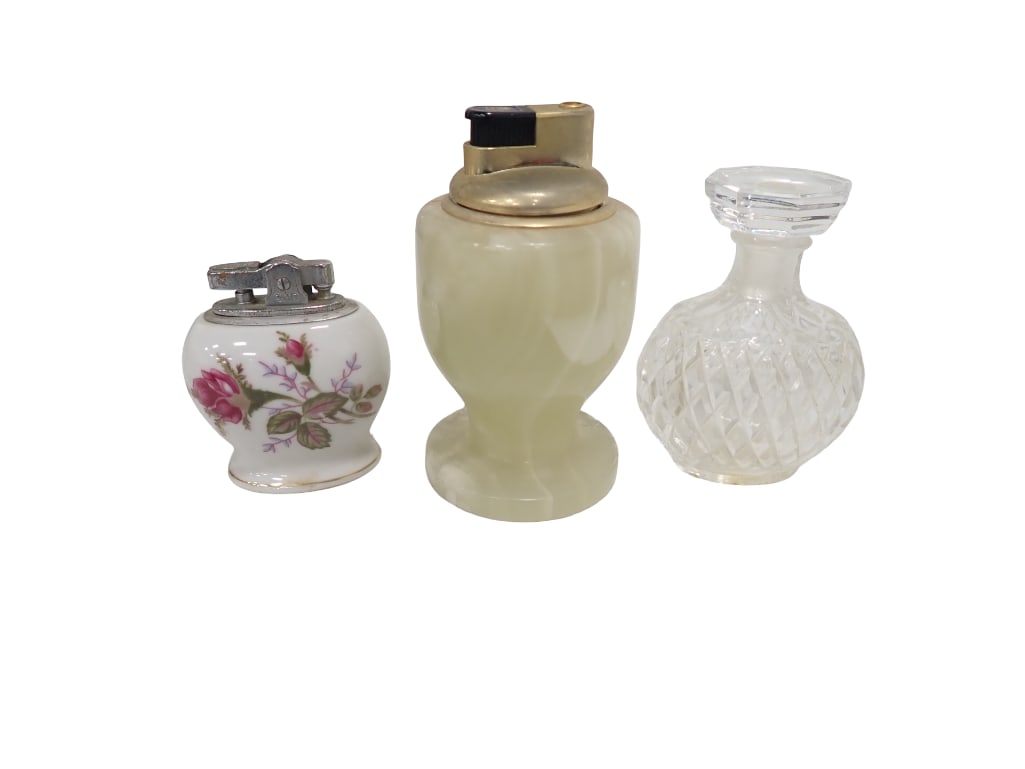 Carved Onyx Lighter, Porcelain Lighter and Nina Ricci Perfume Bottle: Carved Onyx Lighter, Porcelain Lighter and Nina Ricci Perfume Bottle All pictures are considered part of the description and should be examined carefully by bidders. Live Auctioneers is now offering L