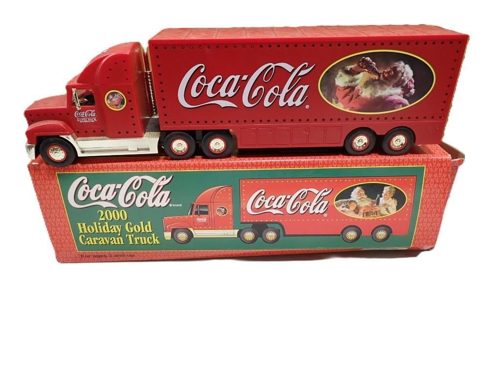 Limited Edition 2000 Holiday Gold Caravan Coca Cola Semi Truck with Box: Limited Edition 2000 Holiday Gold Caravan Coca Cola Semi Truck with Box 15x5x3" All pictures are considered part of the description and should be examined carefully by bidders. Live Auctioneers is