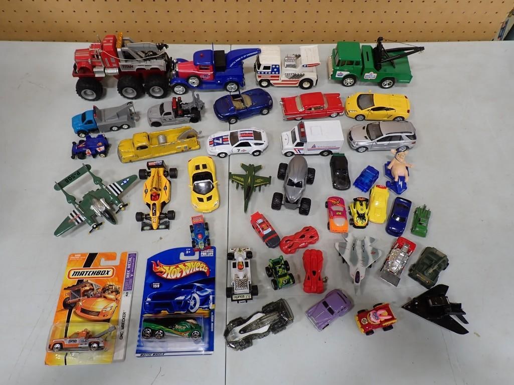 Assorted Toy Cars and Trucks including New in Package Matchbox, Hot Wheels, Airplanes, etc.: Assorted Toy Cars and Trucks including New in Package Matchbox, Hot Wheels, Airplanes, etc. 5x2x2" All pictures are considered part of the description and should be examined carefully by bidders.