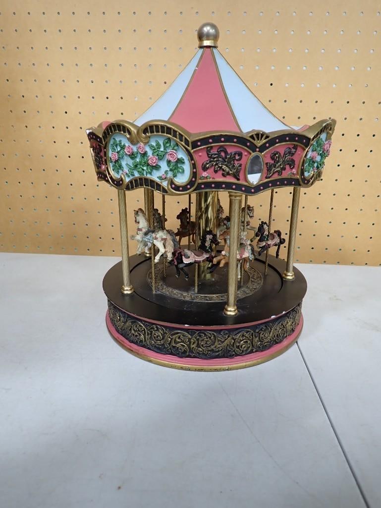 San Francisco Music Box Company Battery Carousel: San Francisco Music Box Company Battery Carousel. Has a small chip on the top - see last picture. untested 14x10x10" All pictures are considered part of the description and should be e