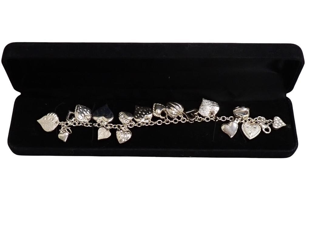 Sterling Silver Charm Bracelet: Sterling Silver Charm Bracelet All pictures are considered part of the description and should be examined carefully by bidders. Live Auctioneers is now offering Live Shipping through them. This 