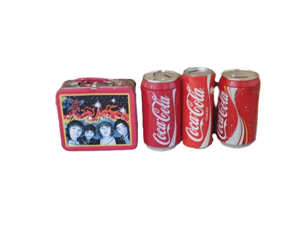 Collectibles Lot including Stranger Things Lunchbox and Coca Cola Banks: Collectibles Lot including Stranger Things Lunchbox and Coca Cola Banks - cans are bigger than standard 12oz cans. These are about 8" tall and the lunch box is regular lunchbox size. All pictures are 