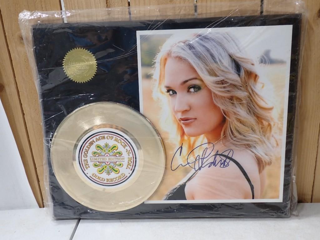Carrie Underwood Limited Edition Gold Record Plaque with COA: Carrie Underwood Limited Edition Gold Record Plaque with COA Signature is a replica All pictures are considered part of the description and should be examined carefully by bidders. Live Auctioneers is
