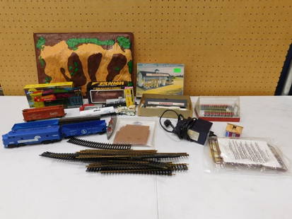 Model Train Lot including Track, Train Cars, Plasticville, Accessories, etc.: Model Train Lot including Track, Train Cars, Plasticville, Accessories, etc. All pictures are considered part of the description and should be examined carefully by bidders. Live Auctioneers is now of